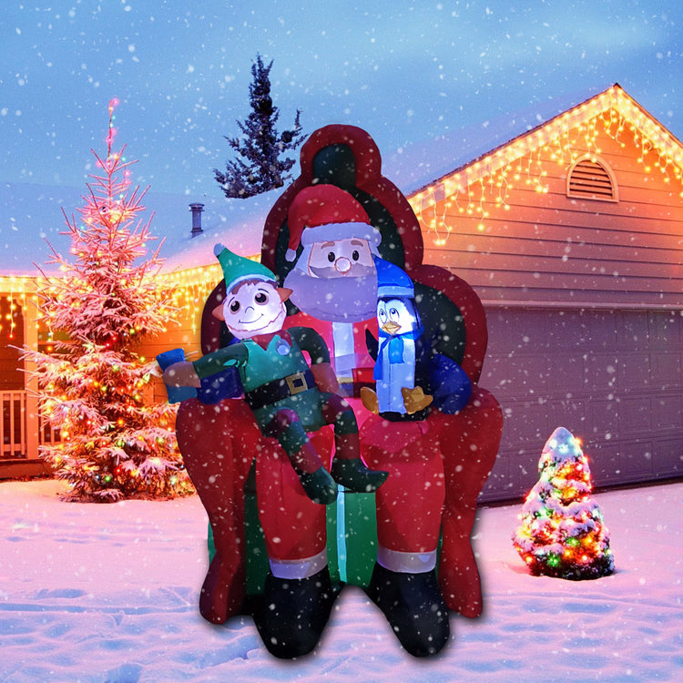 6Ft SeasonBlow Inflatable Christmas Santa Claus and Elf sitting on the sofa